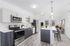 Modern open-plan kitchen and living area with sleek appliances, stylish breakfast bar, and natural light.