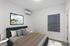 Chic bedroom with modern decor, featuring a comfortable bed, stylish art piece, and soft lighting for a cozy atmosphere.