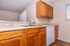 Modern kitchen with elegant wood cabinets, a double sink, and sleek countertops, offering a perfect blend of style and functionality.