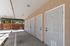 Modern storage area featuring a row of sleek, secure doors with ample space in a well-lit environment.