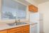 Bright and inviting kitchen with modern sink, spacious countertop, and sleek appliances enhancing functionality and style.