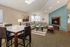 Inviting living area featuring a cozy fireplace, modern furnishings, and ample natural light, perfect for relaxation and entertaining.