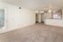 Bright open-plan apartment featuring fresh neutral decor, spacious living area, and modern kitchen ideal for entertaining.
