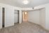 Bright, spacious room with plush carpeting and ample closet space, perfect for luxurious living.