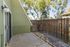Charming outdoor patio with rustic wooden fence, perfect for relaxing and enjoying nature.