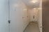 Bright and secure storage corridor with numbered lockers and modern lighting.