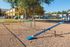 Inviting playground area with colorful equipment, perfect for family-friendly outdoor fun in a vibrant community setting.