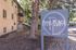 Charming Park Place Apartments nestled among lush trees, featuring a welcoming sign at 201-204 Beaver Ct.