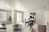 Bright and modern living space showcasing an elegant dining area, stylish furniture, and large windows for ample natural light.