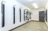 Modern bike storage room featuring vertical racks and sleek design for efficient space utilization.