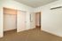 Bright, inviting bedroom with spacious closet and modern air conditioning, offering comfort and ample storage space.