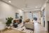 Bright, contemporary living room with elegant decor, featuring a cozy beige sofa, chic geometric rug, and stylish accents, all under warm natural light.
