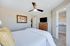 Bright and cozy bedroom featuring elegant decor, plush bedding, and a spacious walk-in closet.