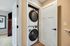 Modern apartment utility closet with sleek stacked washer and dryer, offering convenient in-home laundry solutions.