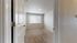 Bright and inviting bedroom featuring plush carpet and a large window for ample natural light.