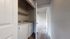 Sleek apartment with convenient in-unit laundry and cozy carpeted room, offering modern living amenities.