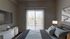 Inviting bedroom with modern decor, featuring a cozy bed, stylish artwork, and a large window with vertical blinds leading to a private balcony.