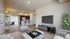 Modern open-concept living space with elegant decor, featuring a cozy living room, stylish kitchen with breakfast bar, and inviting dining area.