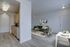 Inviting open-concept apartment with modern kitchen, elegant living room featuring stylish decor, and cozy dining area.