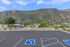 Scenic view from the parking lot showcasing stunning mountain landscape on a beautiful clear day.