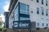 Modern apartment building showcasing sleek architectural design with large windows and a stylish entrance at The Eddy, 347 & 348 Eddy Drive.