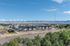 Scenic community with modern townhouses, nestled by a river with a stunning mountain backdrop, offering a perfect blend of tranquility and convenience.