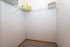 Spacious walk-in closet with wire shelving, ideal for organized storage in a modern apartment.