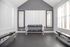 Bright and modern fitness room equipped with dumbbells and benches, perfect for a home gym setup.
