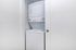 Compact and efficient in-unit laundry area featuring a sleek stacked washer and dryer behind a white closet door.