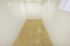 State-of-the-art indoor racquetball court with polished wooden flooring and bright lighting, perfect for sports enthusiasts.