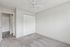 Inviting bedroom with plush carpet, built-in closet, and ceiling fan, perfect for a comfortable living space.