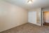 Welcoming bedroom with plush carpeting, ample closet space, and neutral tones perfect for personalization.