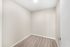 Cozy room with elegant light-colored walls and modern wood flooring, perfect for a home office or creative space.