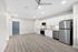 Bright modern kitchen with sleek white cabinetry, stainless steel appliances, and an inviting open layout.