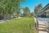 Charming apartment complex featuring lush green lawns, well-maintained landscaping, and inviting walkways.