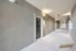 Modern apartment corridor with elegant lighting and sleek design at The Chateau Apartments.