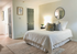 Bright and inviting bedroom with a plush bed, modern decor, and calming neutral tones, perfect for relaxation.