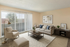 Inviting living room with modern furniture, natural light, and a cozy ambiance, perfect for relaxation and entertainment.