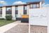 Charming apartment complex exterior with stylish modern design and well-maintained landscaping at Oakwood Bend on E San Miguel St.