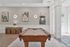 Elegant recreational space with a classic billiards table, modern art, and stylish decor creating a chic ambiance.