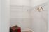 Spacious walk-in closet with sleek wire shelving and ample storage space, perfect for organizing your wardrobe.