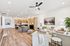 Sophisticated open-concept living area with modern kitchen, elegant seating, and stylish decor, perfect for hosting and relaxation.