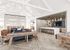 Luxurious open-concept living space with modern furnishings, a sleek kitchen, and cozy seating areas, perfect for entertaining.