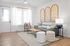 Bright and inviting living room with modern decor, featuring elegant wall art, cozy seating, and soft natural light.