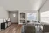 Tastefully designed living room with cozy seating, stylish decor, and large windows filling the space with natural light.