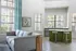 Bright living space with modern furnishings, large windows, and airy decor.