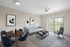 Elegant living space with modern furniture, featuring a cozy sofa, dining area, and large windows with natural light.
