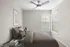 Bright and cozy bedroom with neutral-toned decor, featuring a plush bed and stylish ceiling fan.