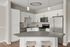Modern kitchen design with sleek white cabinets, stainless steel appliances, and a spacious island with bar seating.