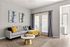 Chic and inviting living room with a modern gray sofa, vibrant pillows, and elegant decor, enhanced by natural light from French doors.